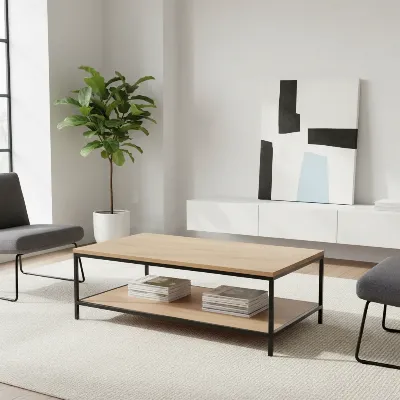 A sleek, minimalist rectangular coffee table with an open metal frame and a light wood top sits in a modern, organized small living room, demonstrating good clearance and smart storage solutions. The room has a tidy, functional aesthetic.